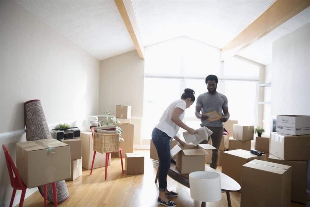 a couple putting things in a box | GC Home Inspection | Preventing Pests Pearland