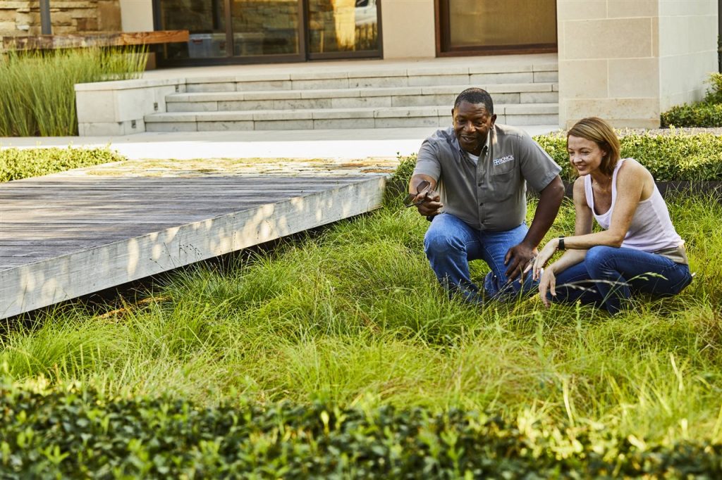 landscape contractor and homeowner in the lawn | GC Home Inspection| landscape professional Pearland