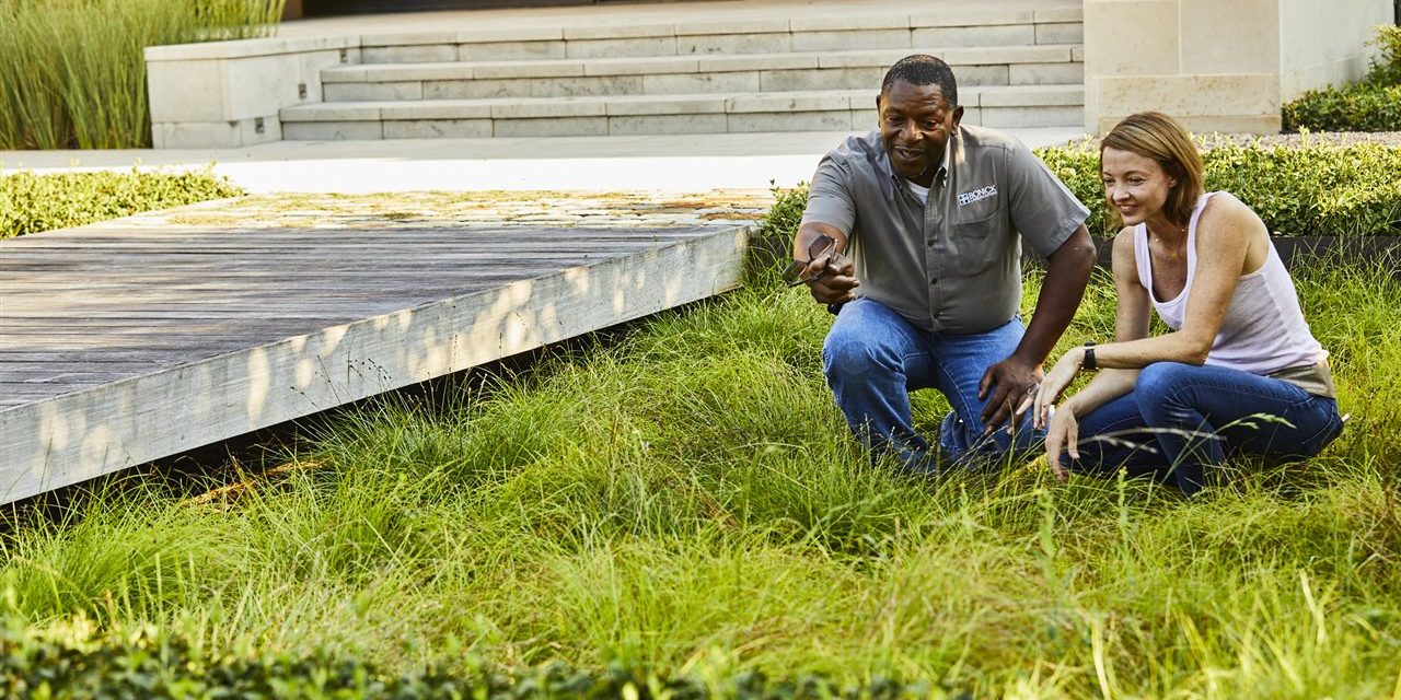 landscape contractor and homeowner in the lawn | GC Home Inspection| landscape professional Pearland