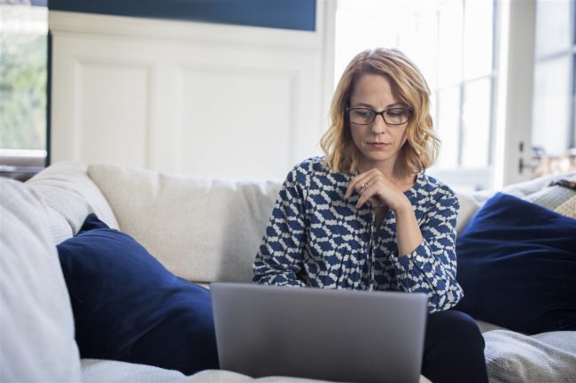 woman looking at her laptop | GC Home Inspection | Pearland Home Inspection | protecting your digital house from cybercrime woman looking at her laptop | GC Home Inspection | Pearland Home Inspection | protecting your digital house from cybercrime
