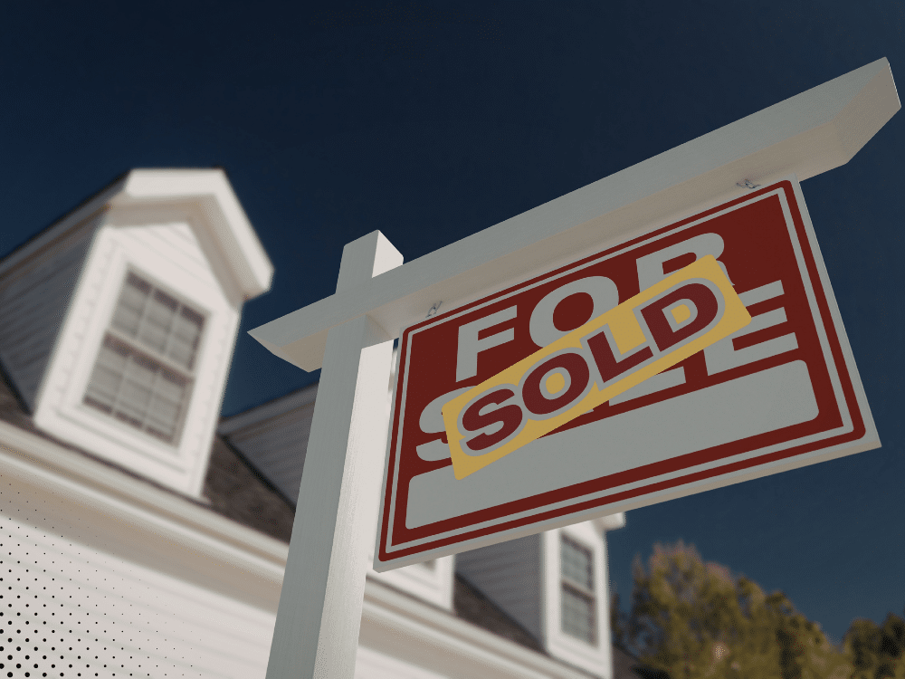 For Sale sign in front of a home in Pearland, TX, with a SOLD sticker, indicating a recently closed property transaction